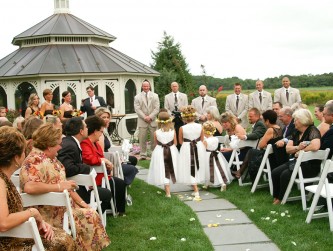 Flower girls walking toward the waiting groomsmen and bridesmaids in front of the Gazebo, Vivid Visions photo